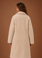 Back view of the Women's long teddy coat displaying the straight longline silhouette