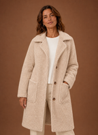 Front view of the Women's long teddy coat showing double-breasted closure and longline silhouette
