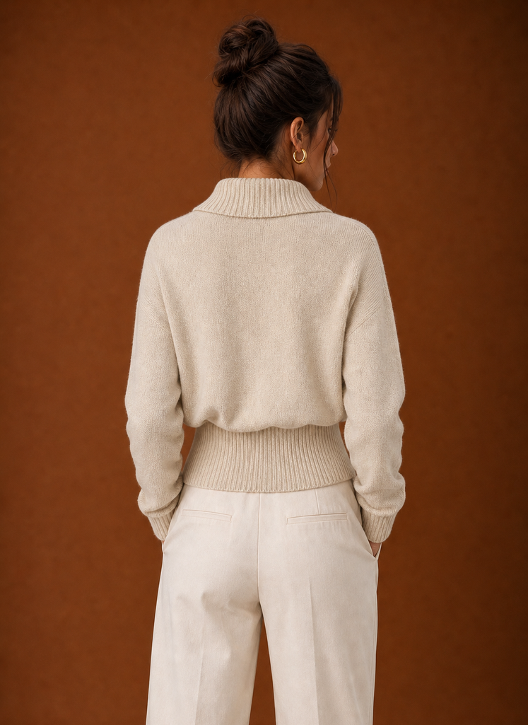 Back view of ribbed knit sweater showing clean hemline and smooth back panel