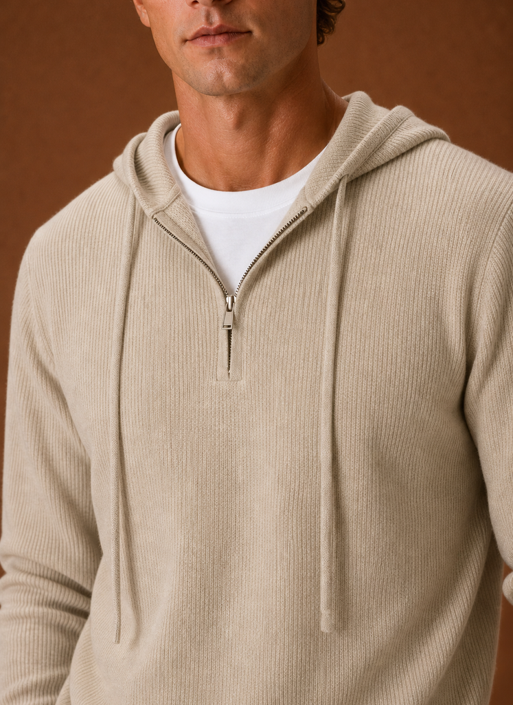 Close-up of the half-zip placket and knit stitch detail on the men's hooded sweater