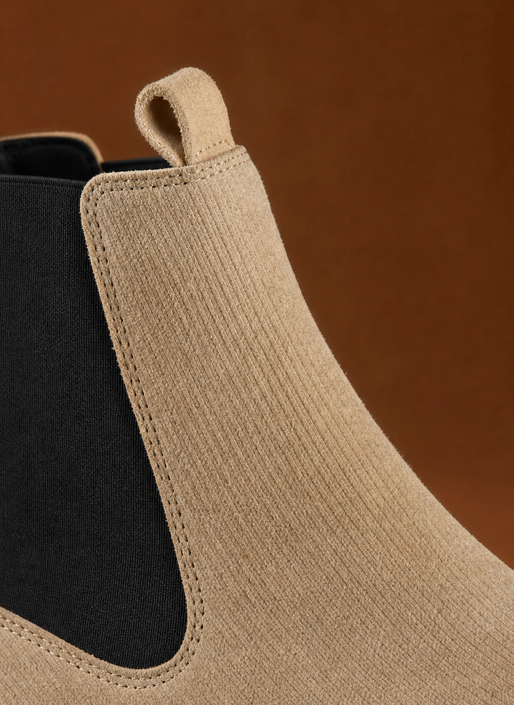 Close-up of chunky lug sole and stitching detail on women's Chelsea boot