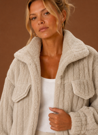 Close-up of the jacket's textured teddy-style exterior and stitched details