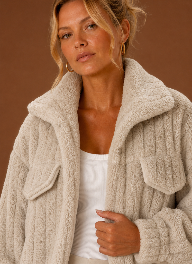 Close-up of the jacket's textured teddy-style exterior and stitched details