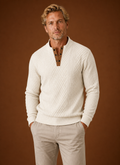 Front view of men's crewneck sweater on neutral background