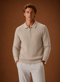 Front view of men's oversized half-zip pullover showing ribbed texture and zipper neckline