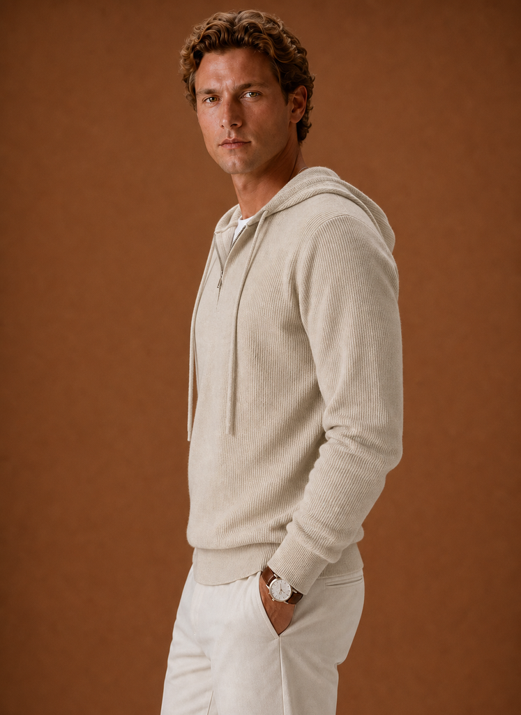 Side profile of the men's hooded half-zip knit sweater highlighting sleeve shape and silhouette