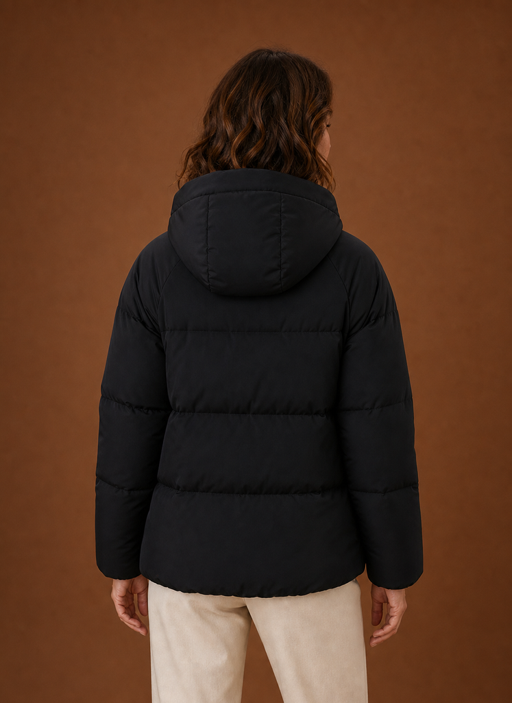Back view of the black hooded puffer jacket showing quilted pattern and hood