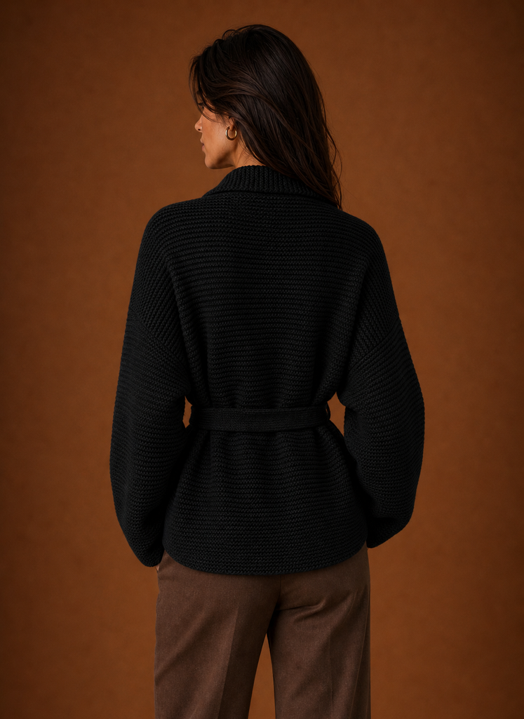 Back view of belted cardigan showing straight hem and chunky knit finish