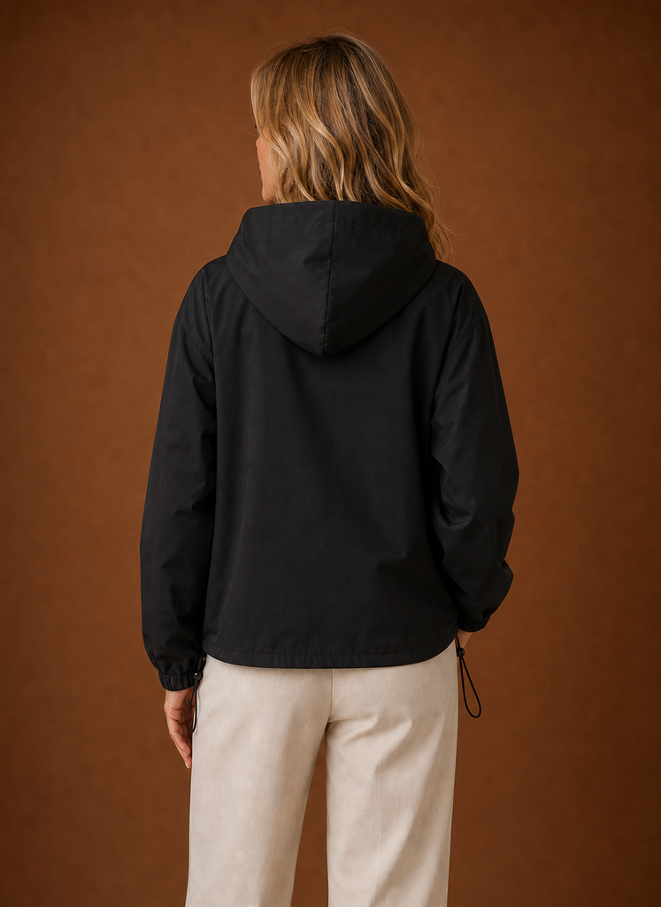 Back view of women's hooded windbreaker jacket displaying clean lines