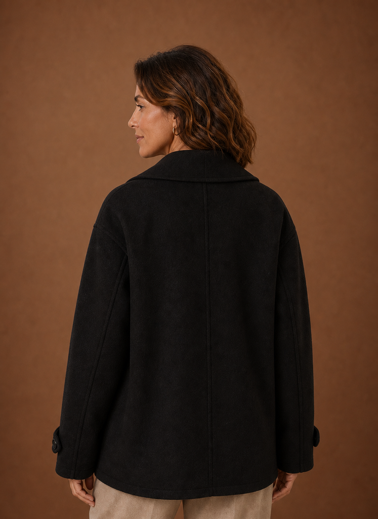 Back view showing relaxed fit and straight back of the women's long coat