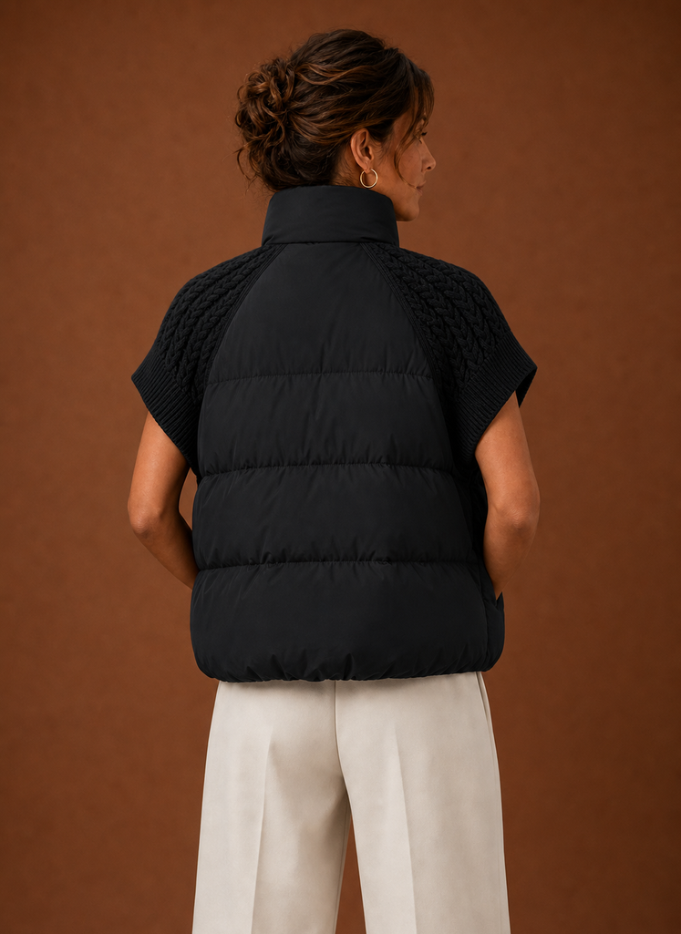 Back view of women's puffer vest highlighting padded body and shoulder detail