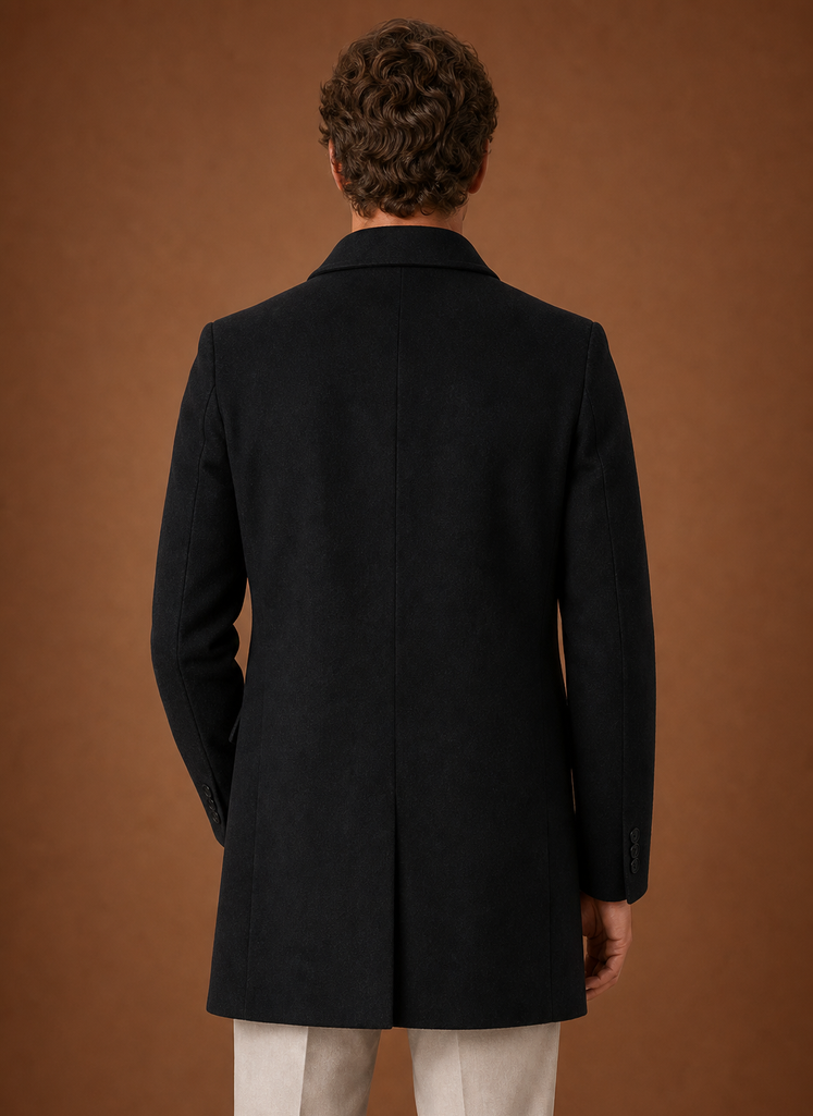 Back view of men's long overcoat showing clean seam lines