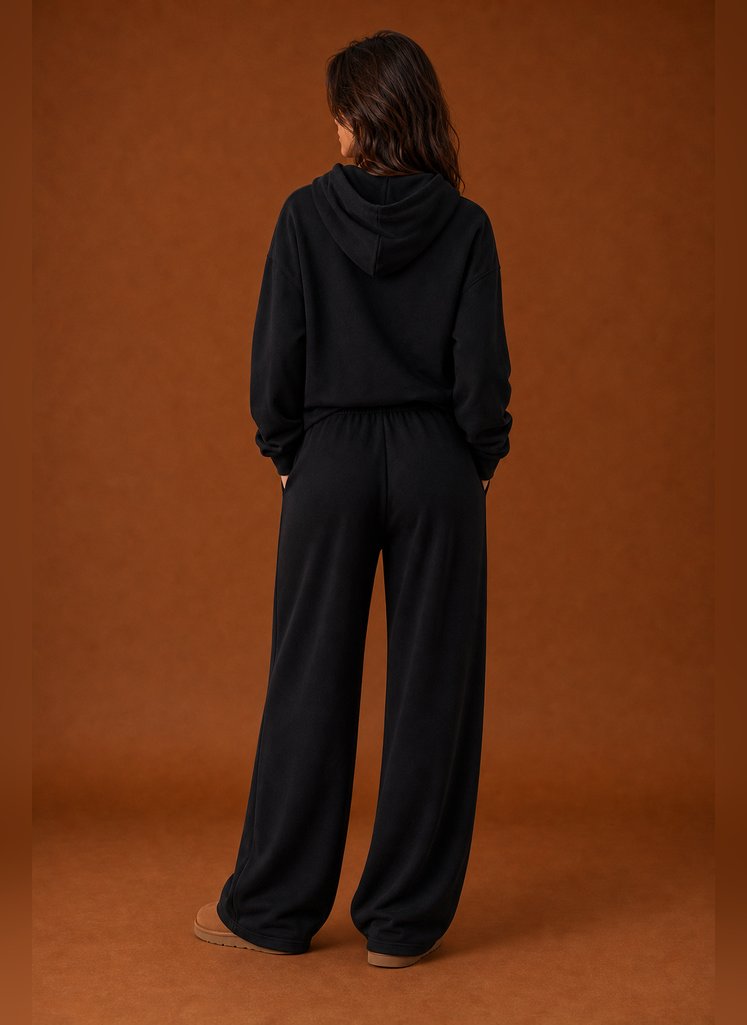 Back view of the two-piece women's sweatsuit showing sweatshirt and matching pant details