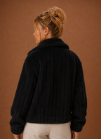 Back view of the women's teddy-style winter coat displaying the clean, minimal lines