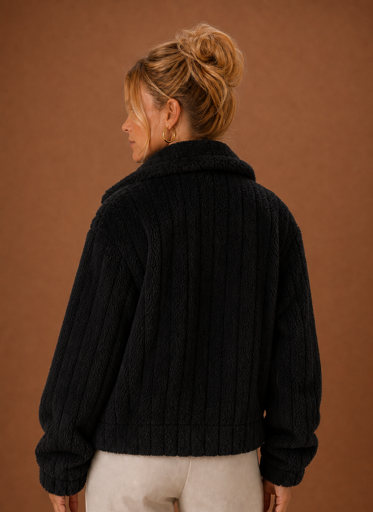 Back view of the women's teddy-style winter coat displaying the clean, minimal lines