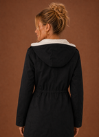 Back view of the long women's parka jacket with hood