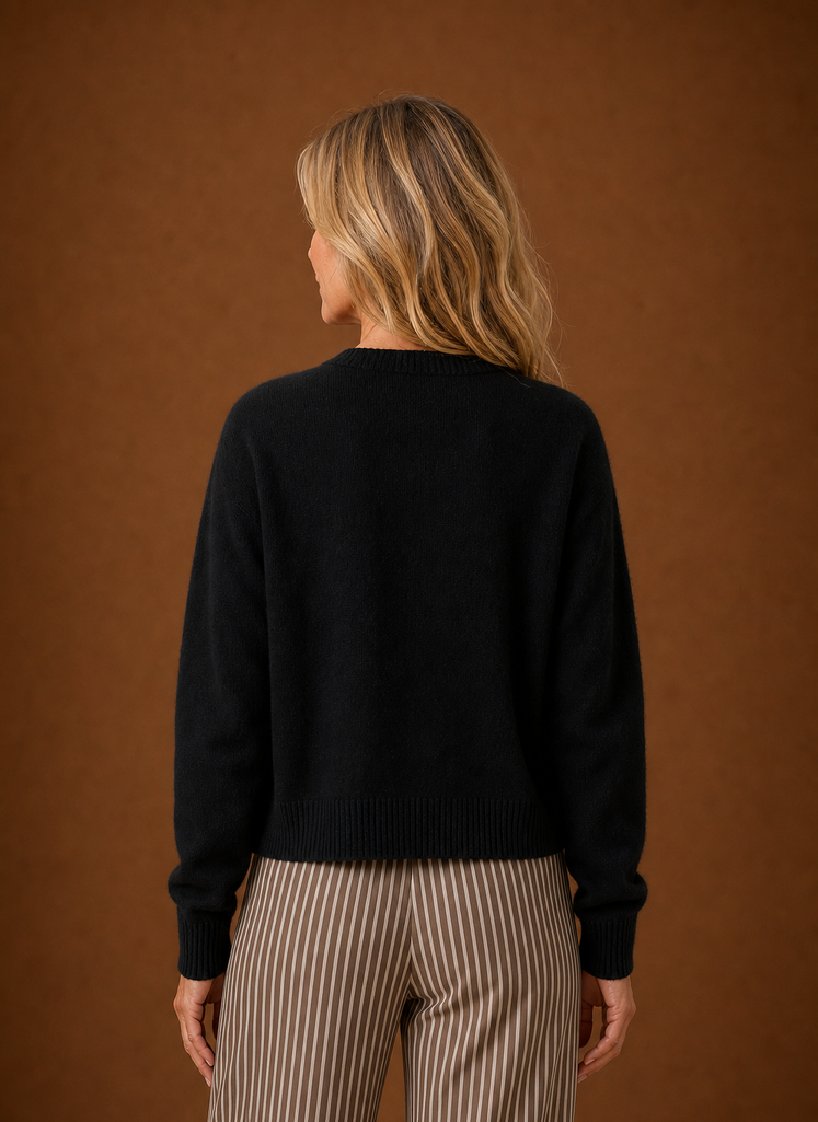 Back view of the women's crew neck cardigan showing the overall fit