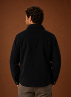 Back view of a men's crew neck knit sweater showing neckline and hem