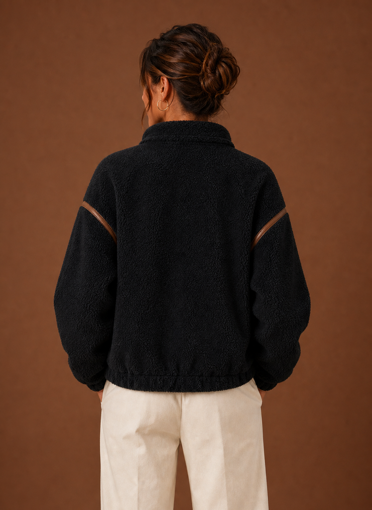 Back view of women's sherpa jacket showing hip-length silhouette