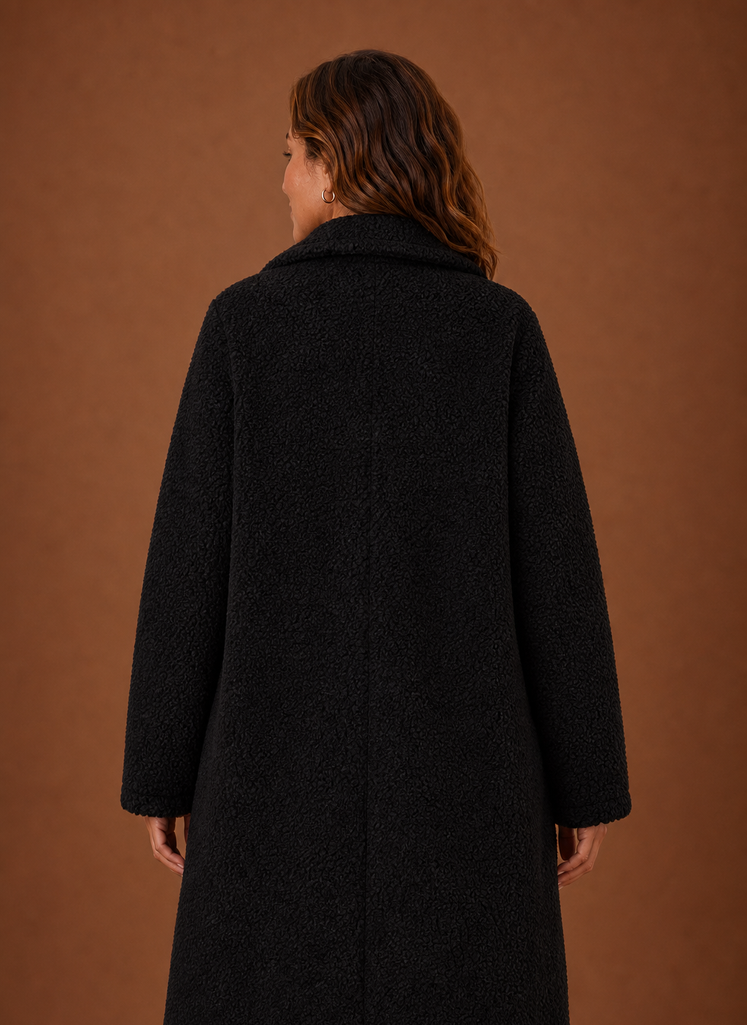 Back view of the Women's long teddy coat displaying the straight longline silhouette