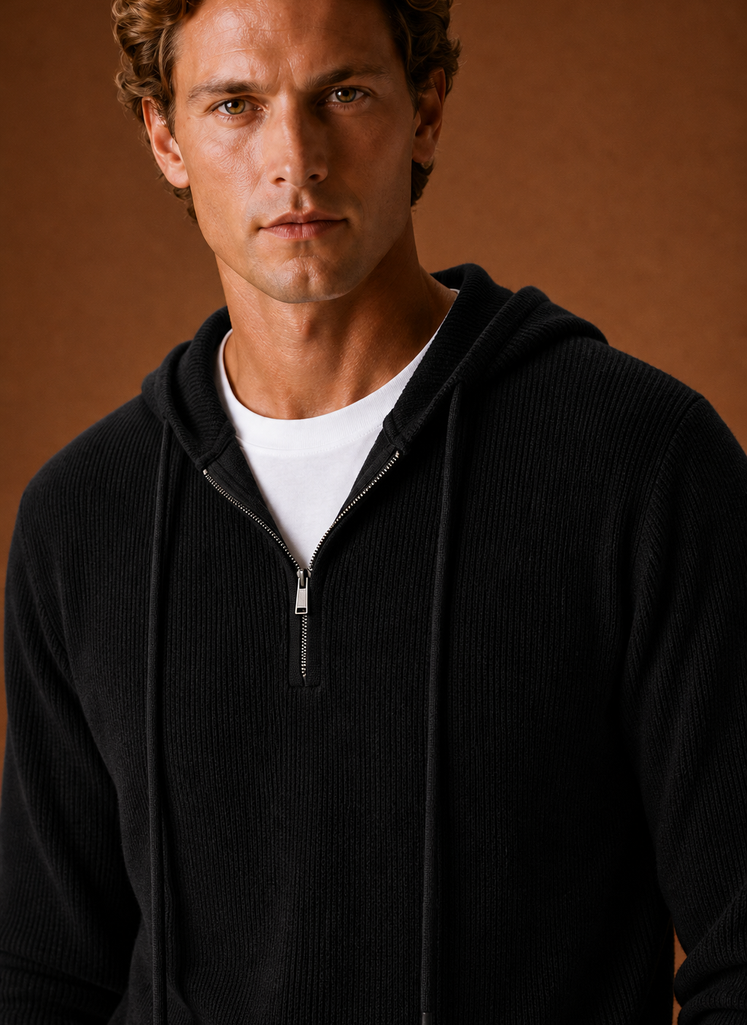 Close-up of the half-zip placket and knit stitch detail on the men's hooded sweater