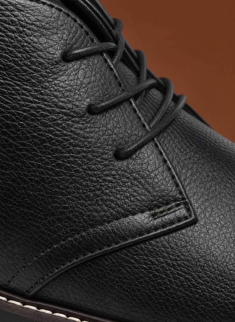 Close-up of Areleon chukka boot showing lacing and stitching details