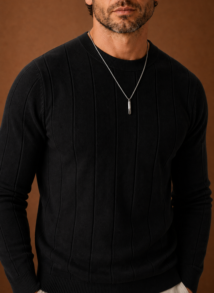 Close-up of ribbed collar and cuff details on the crew neck sweater