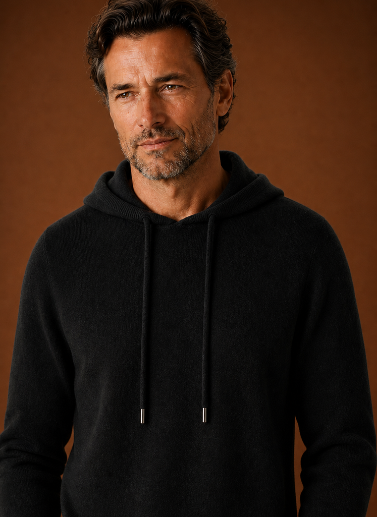 Close-up detail of the knitted texture and hood seam on the Areleon sweater