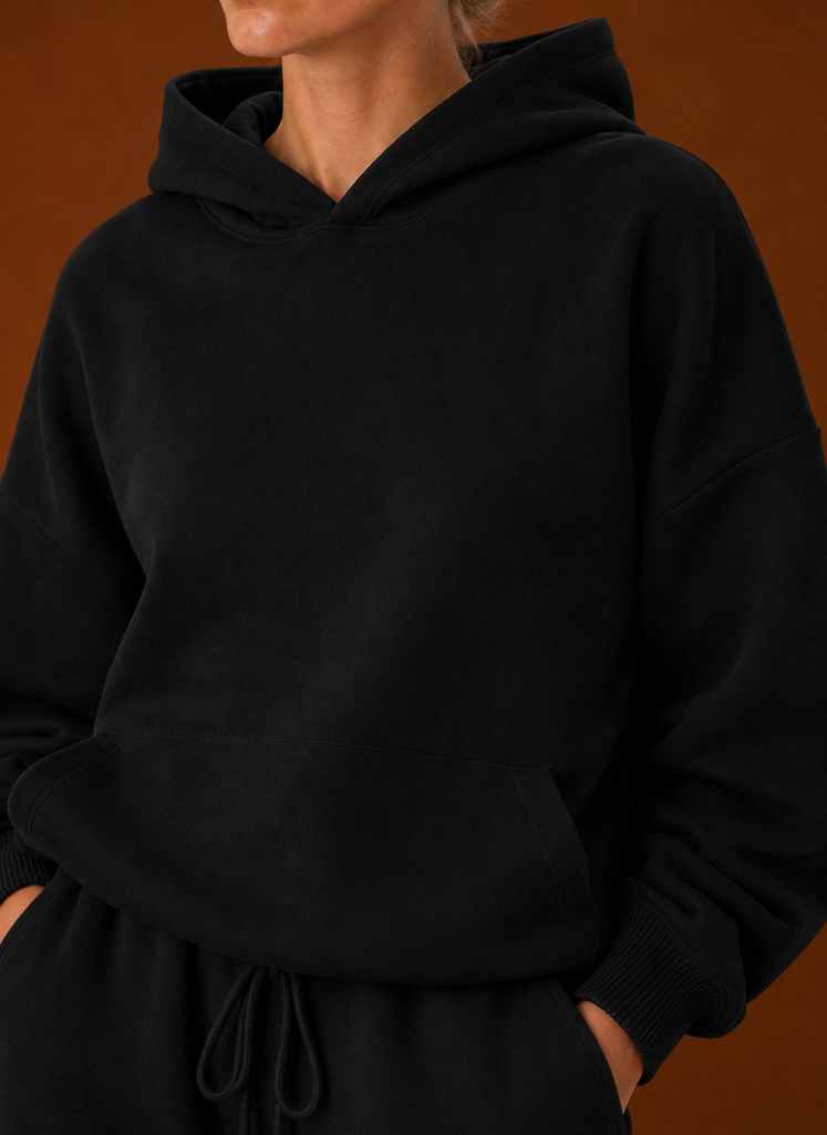 Close-up of the sweater and pants showing fabric texture and seam details