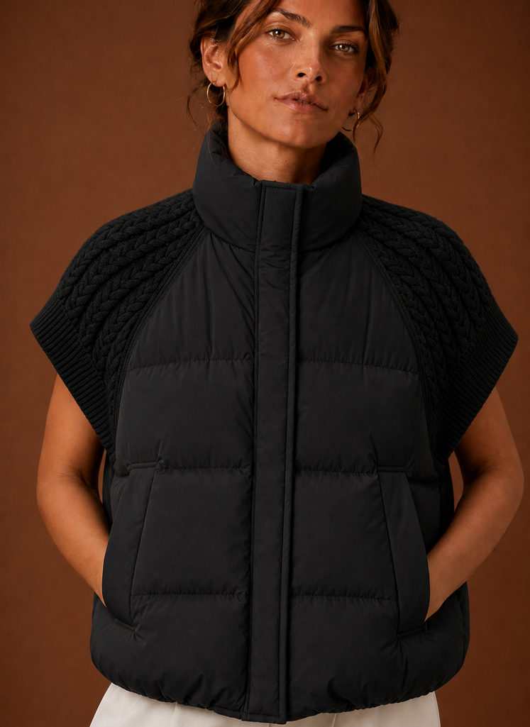 Close-up of knit shoulder panel and puffer stitching on women's vest