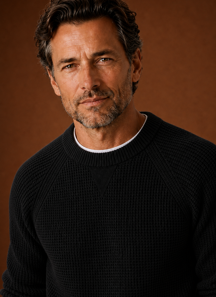 Close-up of textured waffle knit pattern and crew neckline on Areleon men's sweater