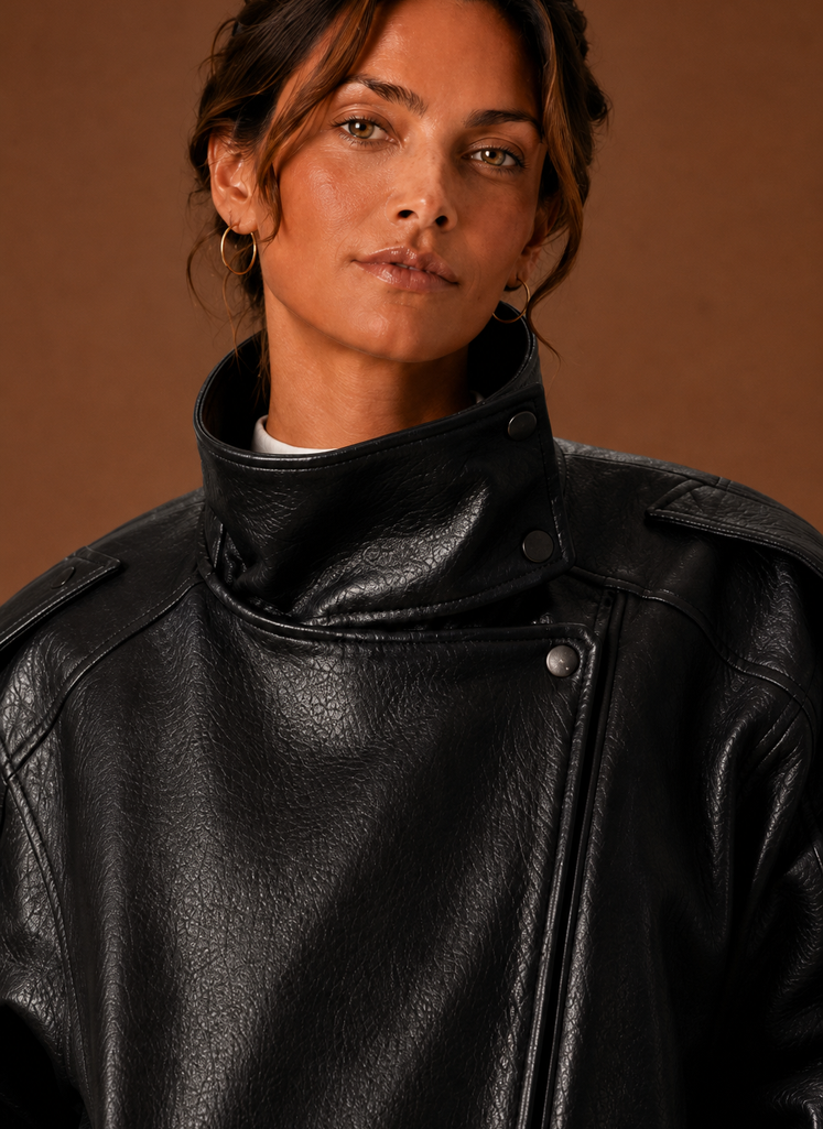 Close-up of the funnel neckline and collar seam on the jacket.