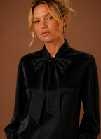 Close-up of the V-neckline and stitch detail on the women's sweater