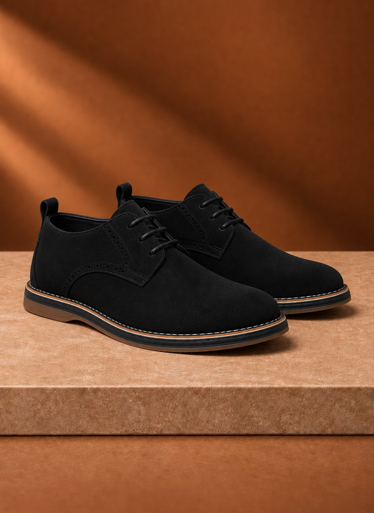 Close-up of the lacing and stitching on the black men's derby dress shoe
