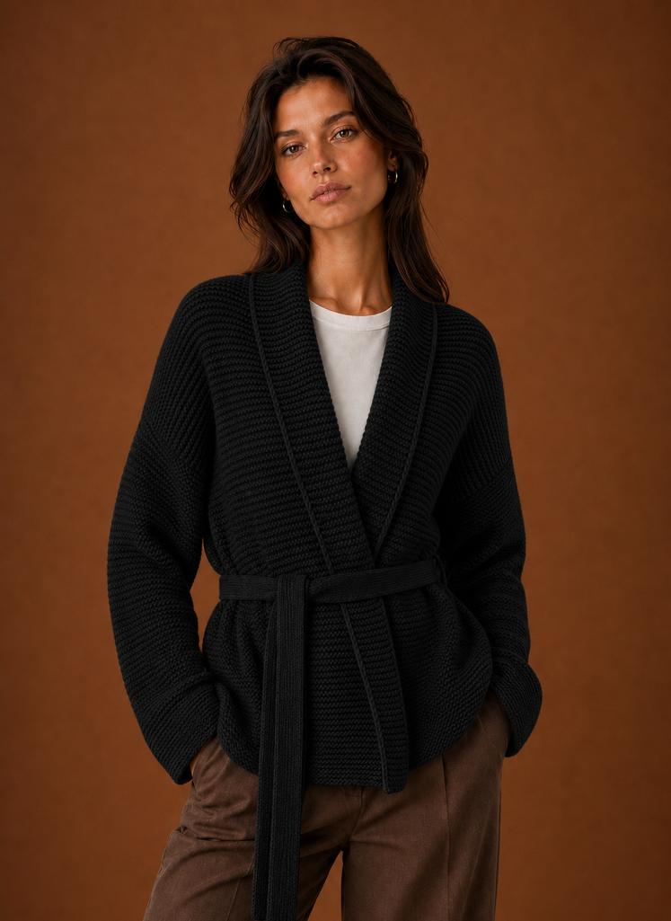 Front view of women's wrap sweater with chunky knit texture and self-tie belt