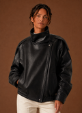 Front view of women's Funnel Neck Jacket showing stand-up funnel collar and clean front silhouette.