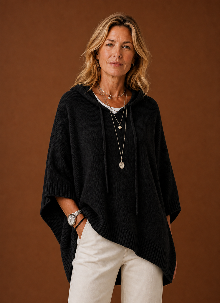 Front view of oversized hooded pullover on mannequin showing hood and relaxed fit
