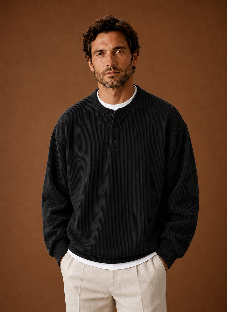 Front view of men's grey ribbed long-sleeve henley shirt on neutral background