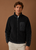 Front view of men's sherpa fleece jacket on a mannequin with zip closed