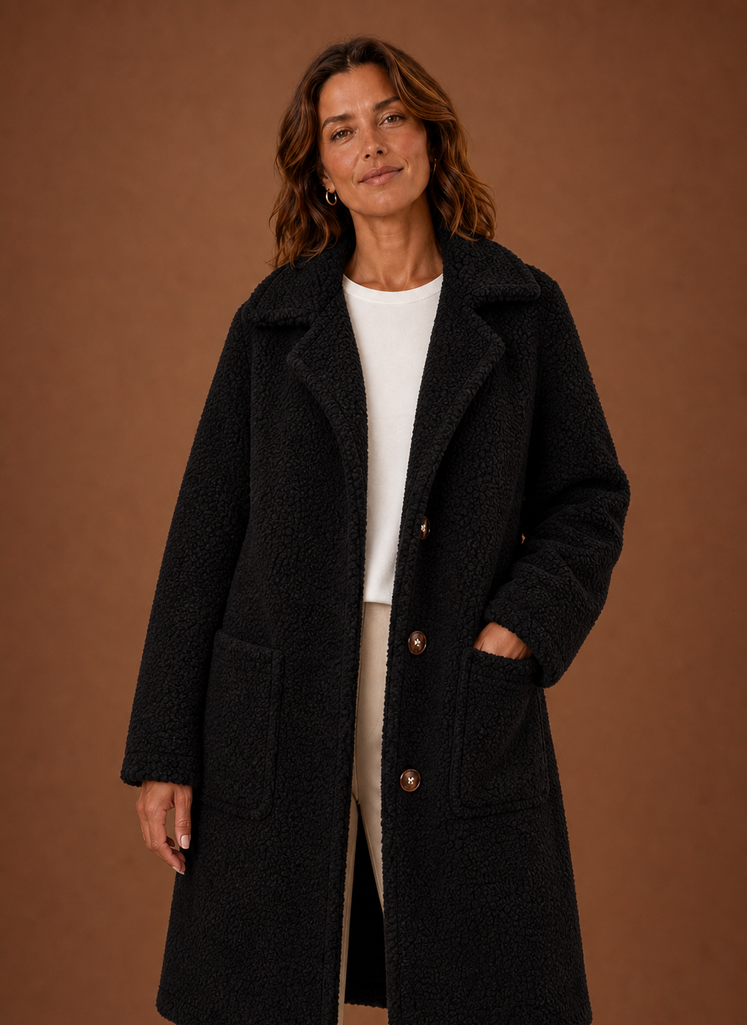 Front view of the Women's long teddy coat showing double-breasted closure and longline silhouette