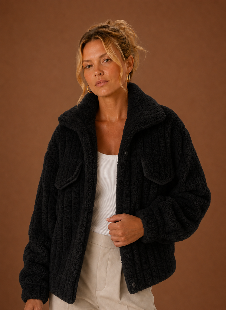 Front view of a women's oversized teddy winter coat on a mannequin with relaxed fit and long sleeves