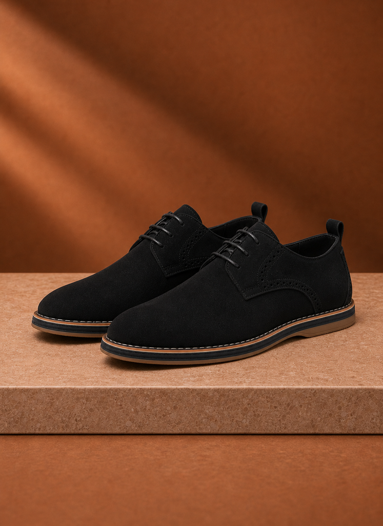 Front view of a black men's derby dress shoe showing the toe and lacing on a neutral background