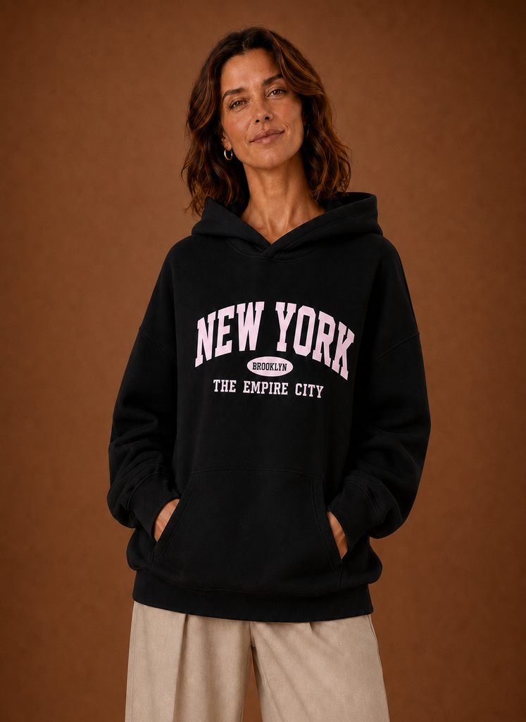 Front view of women's oversized hoodie with New York graphic on the chest
