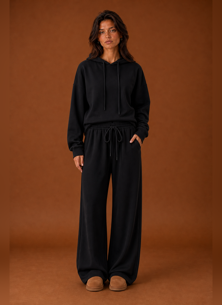 Front view of a women's two-piece sweatsuit set showing sweatshirt and matching pants on a mannequin