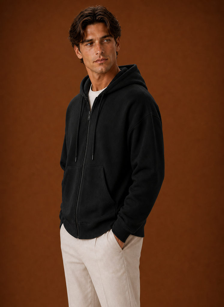 Side view of hoodie highlighting the attached hood and zip closure