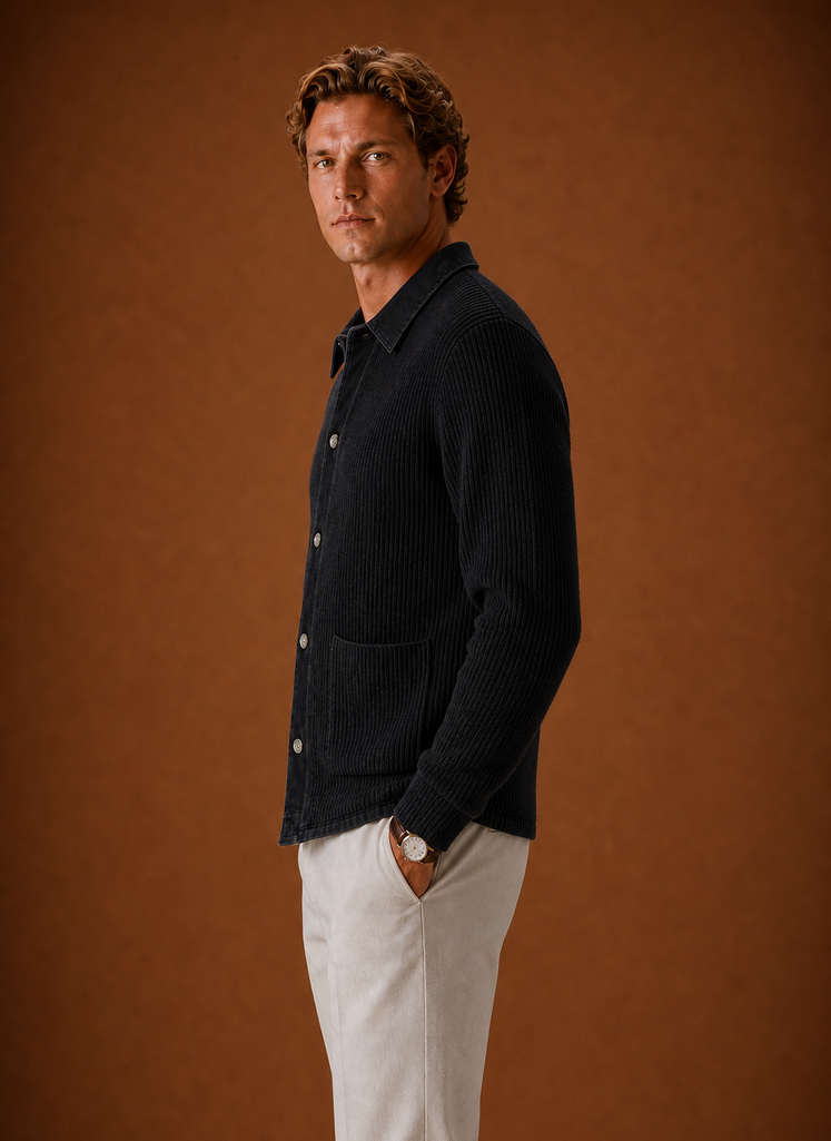 Side profile of men's black knit cardigan showing slim fit and long sleeve shape