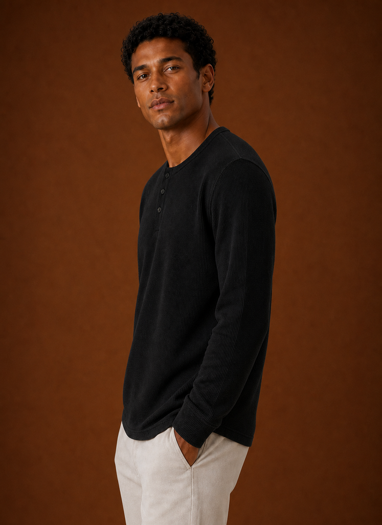 Side profile of men's Henley shirt displaying sleeve and silhouette