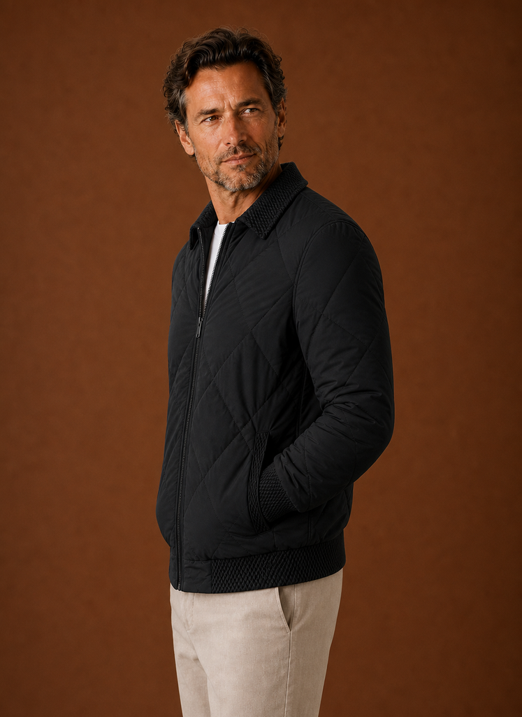 Side profile of men's quilted bomber jacket showing silhouette and pocket