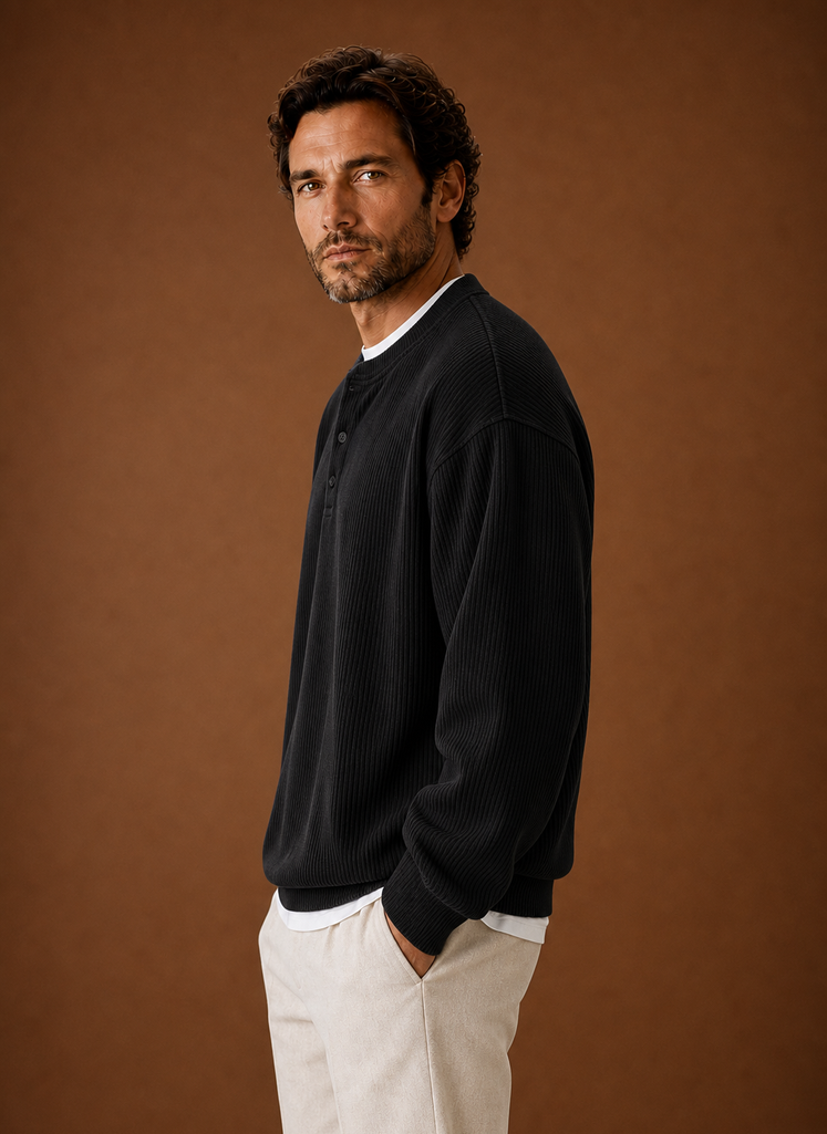 Side view of men's black ribbed henley shirt showing sleeve and shoulder