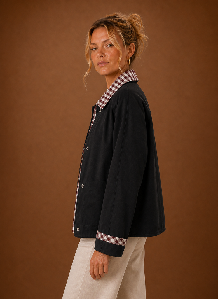 Side view of the barn jacket highlighting the relaxed fit and cropped silhouette